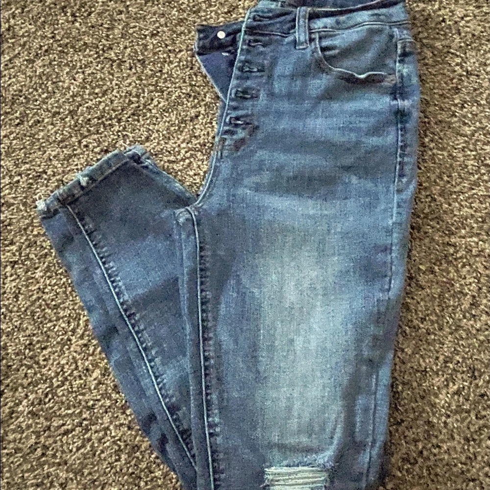 Button fly distressed jean